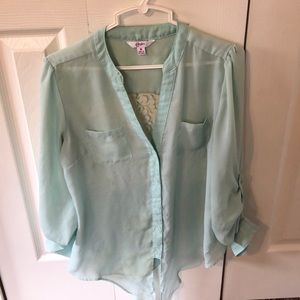 Green button down blouse.